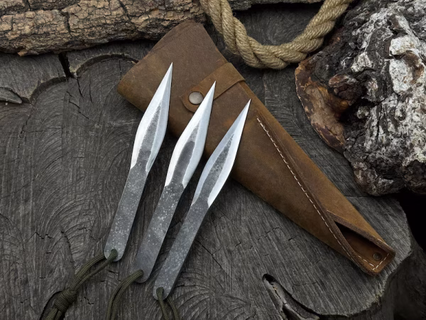 Throw Knife Set 3 pcs. Balanced Blades. Hand Forged From Hardened Carbon 52100 Steel, Ergonomic Handle with Paracord, Leather Roll.